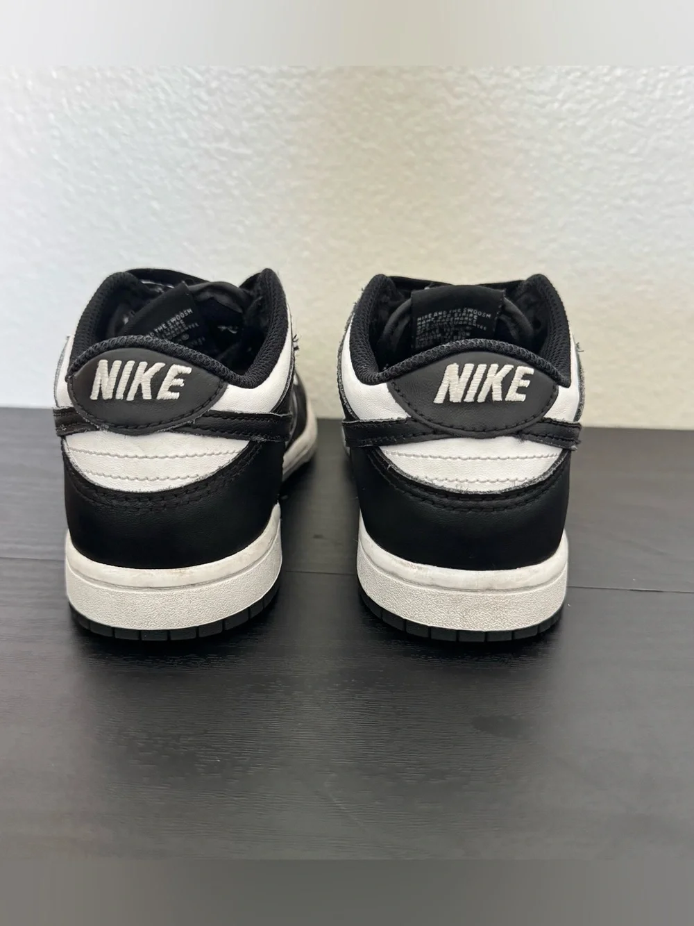 Children’s Nike Dunk Low black and white tennis shoes